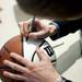 A basketball is signed before the basketball banquet on Tuesday, April 16. AnnArbor.com I Daniel Brenner